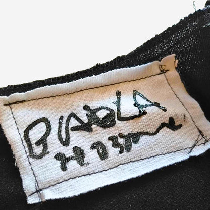 Face No.001 | Un-knitted Yarn thingamajig – Oversized Black Sleeveless Top