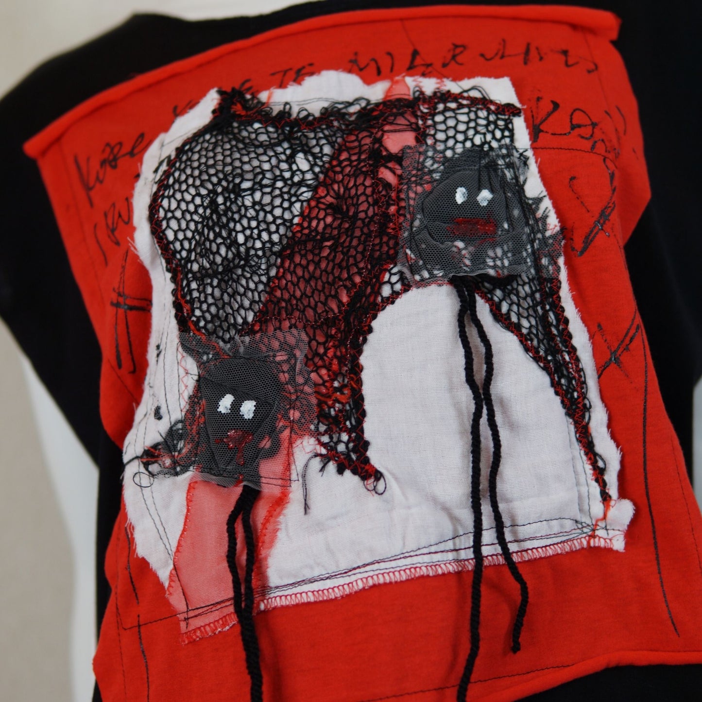 Face No.001 | Un-knitted Yarn thingamajig – Oversized Black Sleeveless Top